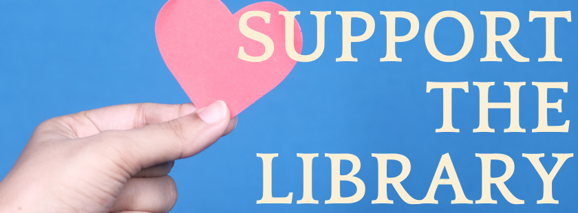 hand holding a paper heart with the words support the library