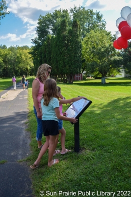Kids reading the Story Walk